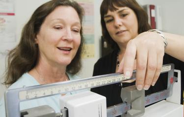 Patient and provider in exam room